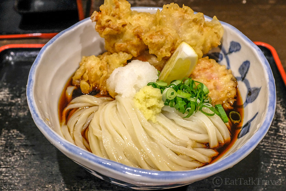 Close up of udon noodles with tempura in Japan.